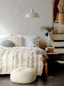 Warm, cream throw on white bed